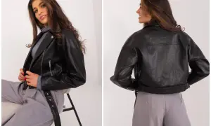 Czarna ramoneska, która inspiruje stylizacje gwiazd. Modelka prezentuje ją z szarymi spodniami.